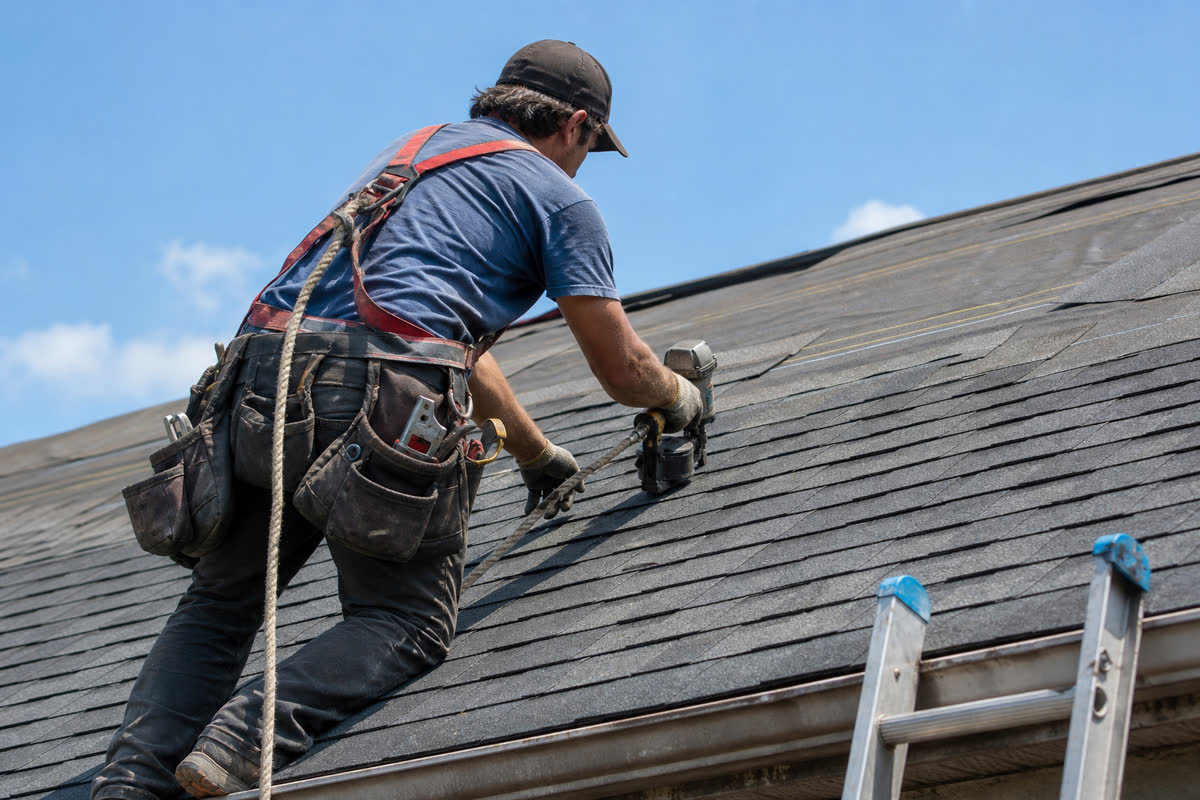 Worker on a residential roof